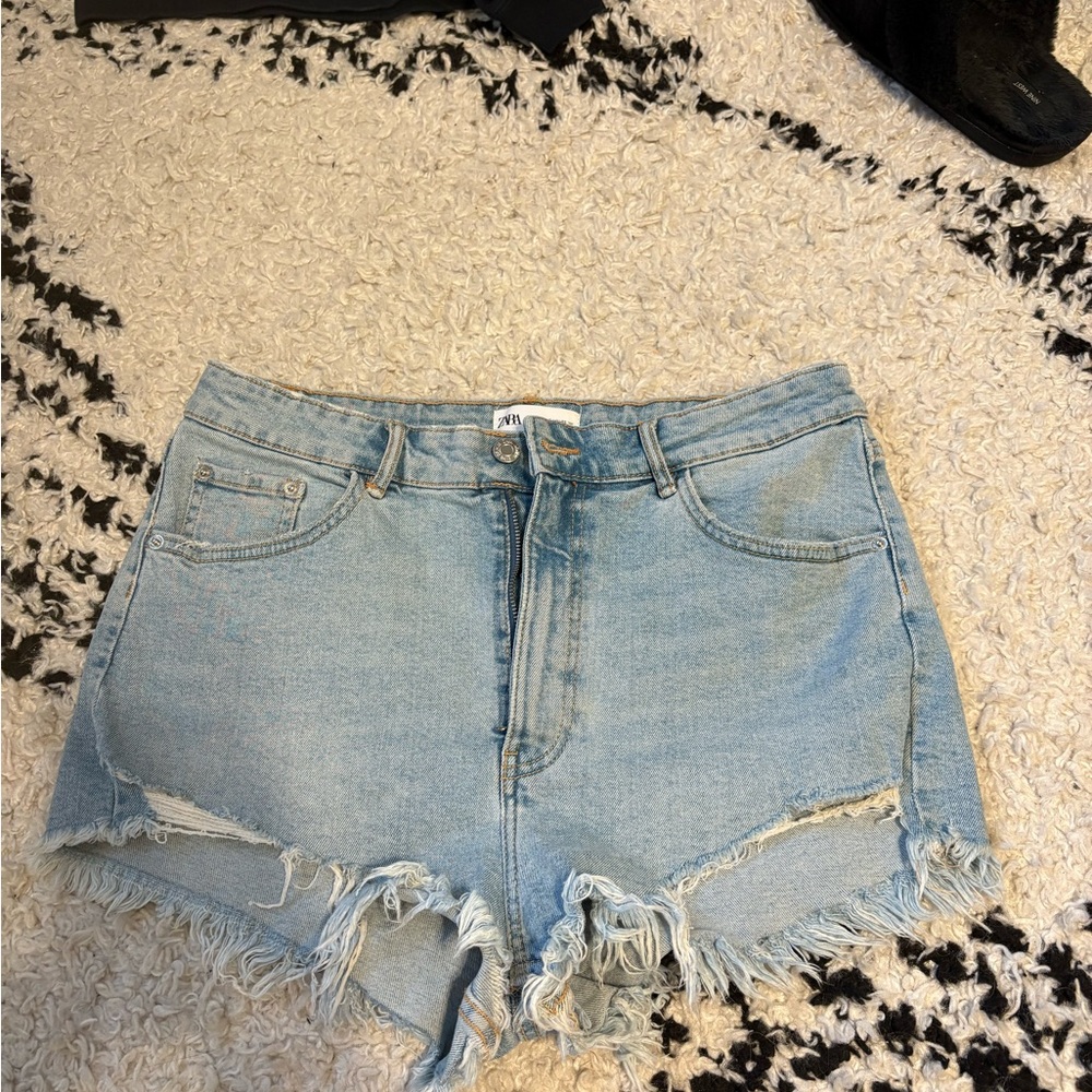 Zara women’s light blue Denim Blue Distressed Shorts